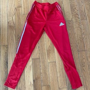 Red Adidas tapered leg sweatpants
